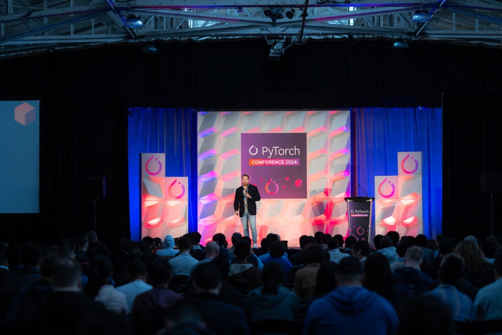 Man talking on conference stage